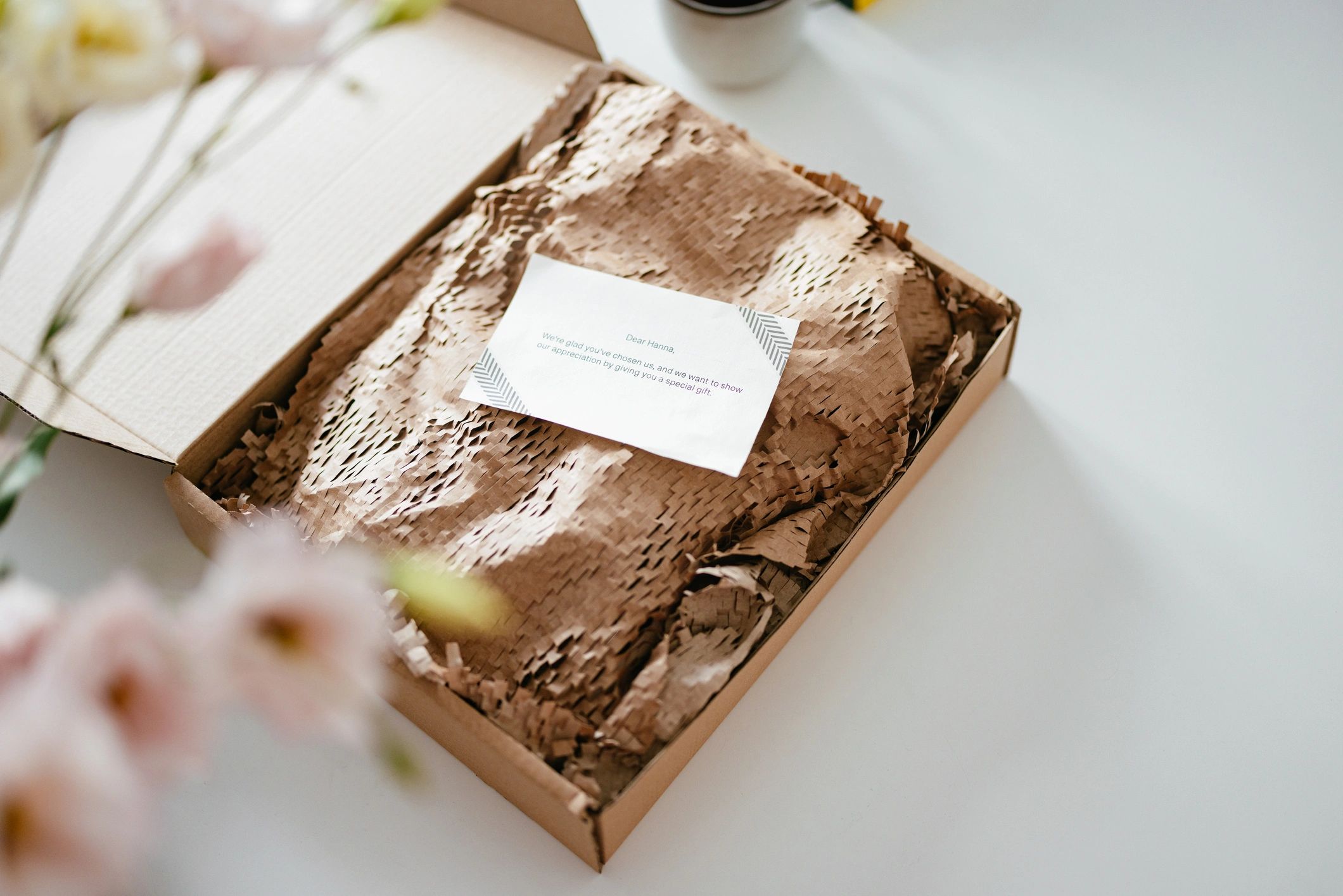 Open gift box with note